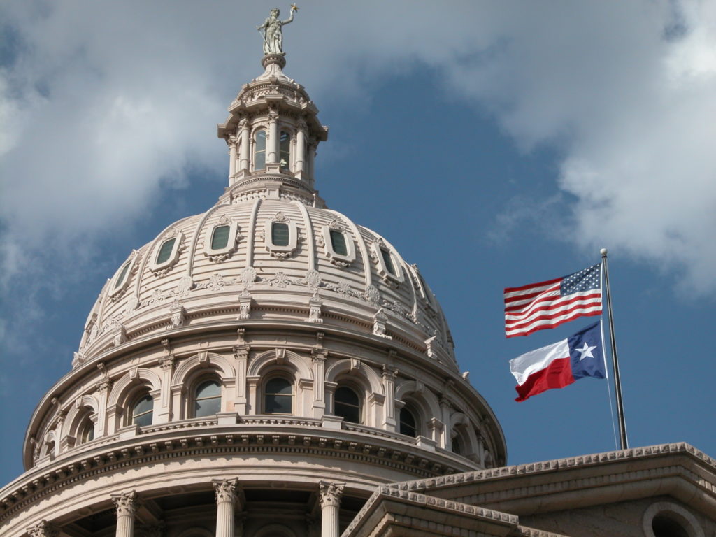 Texas capitol with flags